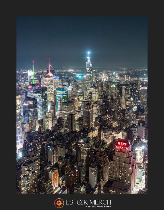 A nighttime cityscape view of  Midtown Manhattan with illuminated buildings